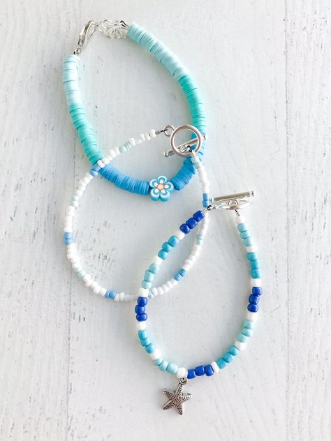 These bracelets come as a set of 3 beachy theme bracelets perfect for a beach day! Made to fit an average adult wrist. Please message me directly for a sizing adjustment (ex. smaller or larger than average) Coastal Bracelet Ideas, Beaded Beach Bracelets, Beachy Crochet Ideas, Ocean Bracelet Ideas, Beachy Bracelet Ideas, Beach Bracelets Clay Beads, Beachy Clay Bead Bracelet, Bracelet Themes, Beach Themed Bracelet