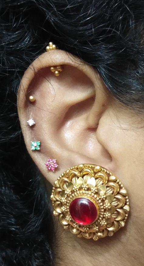 Antique Bahubali Earring from Tanishq matched with Small Ruby Earring, Emerald Earring, Diamond Earring and Gold from Tanishq❤ Gold Earrings Designs Traditional, Tanishq Earrings Gold Design, Koppu Designs Gold, Bugdi Earring Design, Bugdi Earrings Gold, Koppu Earring, Bugadi Earring Design In Gold, Bugdi Earrings, Ear Piercings Indian