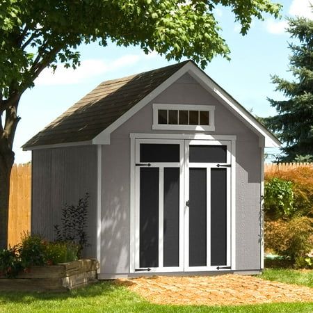 The Handy Home Tribeca 10 ft. x 12 ft. Do-It-Yourself Wood Shed Kit stands out with its deep roof overhangs and contemporary styling. This premium storage shed features treated, engineered wood siding to resist fungal decay and wood-destroying insects and choice, 2 ft. x 4 ft. wood framing for ground-to-peak strength. Pre-hung, 56 in. W x 6 ft. H double doors are mounted on full-length galvanized steel hinges. This reduces load stress, prevents door sagging and keep doors aligned for optimal per Brown Shingles, Black Shingles, Contemporary Sheds, Wood Shed Kits, Outdoor Storage Buildings, Farmhouse Sheds, Engineered Wood Siding, Wood Storage Shed, 2x4 Wood