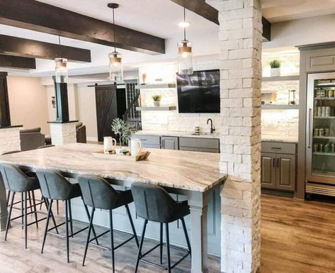 25 Basement Bar Ideas for a Stellar Rec Room Downstairs Basement Bar With Post, Basement Bar Kitchenette, Basement Kitchenette With Island, Basement Island Bar Ideas, Basement Bar With Tv, Basement Bar Designs Layout, Family Room With Bar, Basement Bar Kitchen, Basement Bar Area