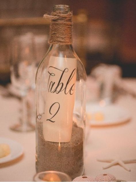 18 DIY Wedding Centerpieces You'll Adore - Society19 Bottle Table Numbers, Beach Wedding Tables, Beach Wedding Decorations Reception, Beach Wedding Colors, Beautiful Beach Wedding, Wedding Favors Cheap, Beach Wedding Decorations, Beach Wedding Favors, Wedding Centerpieces Diy