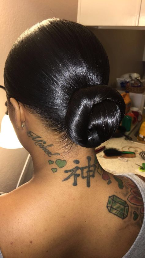 Low Bun Ponytail Hairstyles For Black Women, Black Women Hair Buns, Lower Bun Hairstyles Black Women, Low Middle Part Bun Black Women, Sleek Low Bun Black Women Middle Part, Slick Back Bun With Extensions, Bun Extensions Black Women, Slicked Back Bun Black Women, Low Bun With Extensions