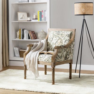 The perfect piece to reflect your novel tastes, this farmhouse armchair anchors your seating ensemble in timeless appeal. Providing you with a rich choice in terms of pattern, this piece is wrapped with polyester blend fabric for a hint of textural appeal and features both stripe and vivid floral patterns in different specific chairs. Built with the clean lines of contemporary aesthetics, it features exceptional, long-lasting details like painstakingly designed carved legs and subtly curved arms Antique Accent Chair, Farmhouse Armchair, Antique Wooden Chairs, Yellow Armchair, Wooden Armchair, Nancy Meyers, Carved Legs, Upholstered Armchair, Turned Leg