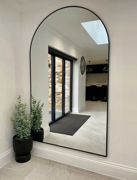 Black Arch Mirror Bedroom, Arc Mirror Living Rooms, Large Mirror In Living Room Wall, Curved Mirror Wall, Big Mirror On Wall, Black White Wood Interior, Mirror On Stairway Wall, Large Mirror Entryway, Mirror For Living Room Wall