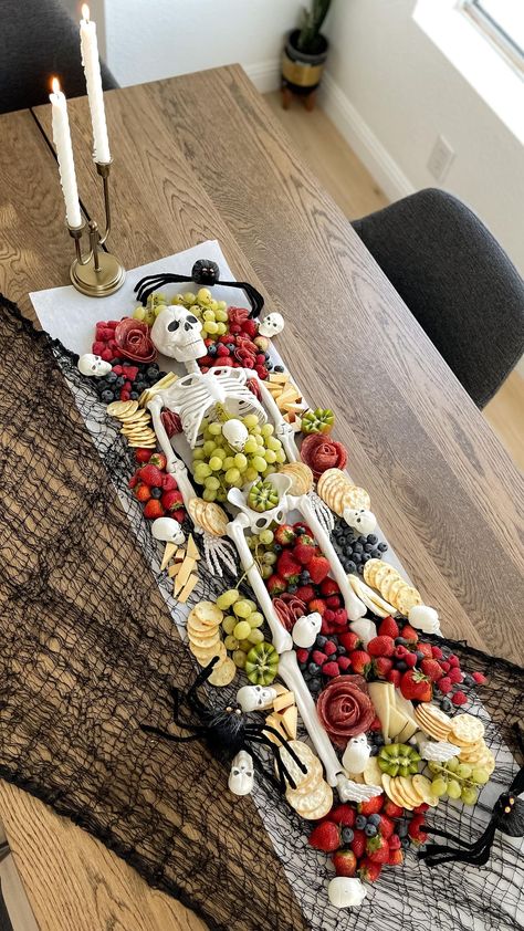 Skeleton Charcuterie Table, Charcuterie Board With Skeleton, Halloween Charcuterie Board With Skeleton, Spooky Charcuterie Board Skeleton, Charcuterie Skelton, Halloween Party Charcuterie Board Ideas, Skeleton Charcuterie Board Ideas, Spookie Charcuterie Board, Halloween Party Food Set Up