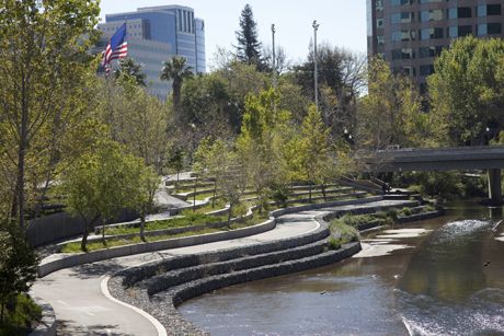 The east bank of Guadalupe River Park provides a glimpse of one of San Jose’s unique urban park settings. (Photo by Ray Rodriguez.) River Park Landscape Design, Guadalupe River, Park River, Linear Park, Urban Landscape Design, Public Space Design, Riverside Park, Landscape And Urbanism, River Park