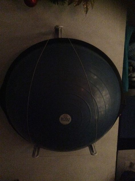 Bad quality but found a cheap fast and easy at to mount a bosu ball on the wall so it isn't laying around cluttering the floor and isn't on a bosu rack that takes up a ton of space. Space consuming!!!!!! Bosu Ball Storage Ideas, Bosu Ball Storage, Yoga Ball Storage, Yoga Nook, Home Gym Storage, Spin Bike Workouts, Workout Room Home, Bosu Ball, Entry Closet