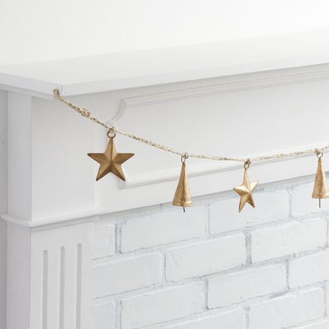 Fireplace Gold, Brass Christmas Ornaments, Bell Garland, Mantle Fireplace, Brass Christmas, Metal Star, Holiday Table Settings, Star Garland, Gold Glam