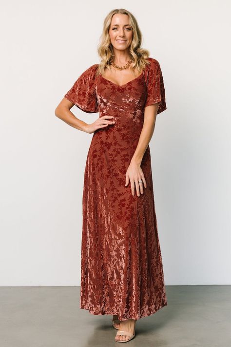 Discover timeless elegance with our Cinnamon long Everley dress featuring a flattering neckline, short flutter sleeves, and a luxurious velvet floral pattern. This dress effortlessly combines sophistication and femininity, making it a stunning choice for any formal event or evening affair. Fitted Maxi Skirt, Fall Bridesmaids, Fall Bridesmaid Dresses, Velvet Bridesmaid Dresses, Destination Dress, Tulle Maxi Dress, Baltic Born, Velvet Maxi Dress, Velvet Maxi