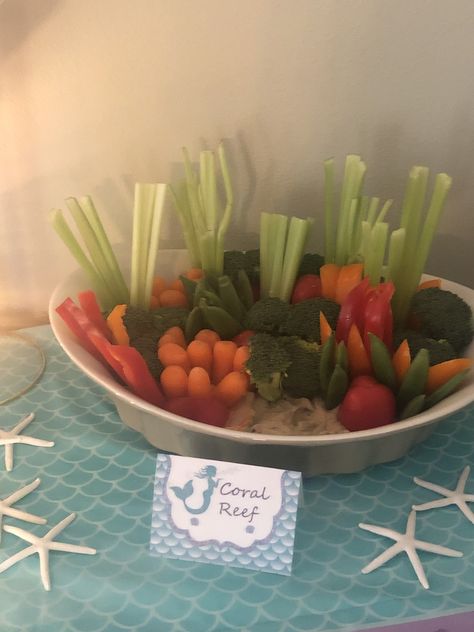 Coral Reef Veggie Tray.  Hummus sand. Mermaid Birthday Party Veggie Tray, Ocean Veggie Tray, Coral Reef Veggie Tray, Spongebob Veggie Tray, Under The Sea Veggie Tray, Mermaid Veggie Tray, Mermaid Birthday Party Food Snacks, Toddler Birthday Food Ideas, Under The Sea Food Ideas