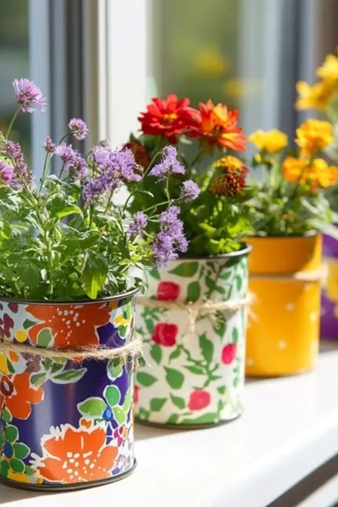 Transform your recycling into chic home decor with these eco-friendly upcycled tin can planters. This project is perfect for those looking to add a personal touch to their garden or indoor space while keeping sustainability in mind. Aimed at garden lovers and DIY enthusiasts, these with can planters are ideal for small succulents and vibrant flowers alike. Grab your old cans, some paint, and get creative. Learn techniques to style them that blend effortlessly with your decor while enjoying the environmentally-friendly advantage. Recycled Tin Can Crafts, Can Painting Diy Tin, Metal Can Crafts, Tin Can Garden Ideas, Diy Tin Can Projects, Tin Can Planters, Creative Planter Ideas, Can Planters, Painted Tin Cans