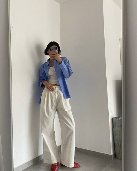 Outfit inspo by @anyamartirosov 🧿☁️ Anya is wearing our Light Blue Oversized Poplin Button Down with our Off White Cotton Drill Pants, styled with our Deep Scoop Ribbed Tank Top and best-selling Black Round Sunglasses 🖤 Shop online now >>> Blue And White Button Up Outfit, Blue Button Up Outfit, Oversized Pants Outfit, Blue Top Outfit, Black Round Sunglasses, Light Blue Top, Black White Outfit, Tank Top Outfits, Ribbed Tank Top