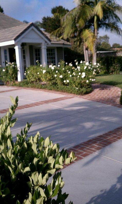 Brick Stamped Concrete Driveway, Driveway With Brick Accent, Driveway Cement Designs, Concrete Driveway With Brick Inlay, Brick Border Driveway, Brick Parking Pad, Concrete Driveway With Brick Border, Driveway To Patio Transition, Brick And Concrete Driveway