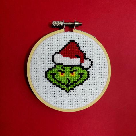 "**This is a downloadable PDF pattern. No physical item will be sent** Name of piece: Santa Grinch Stitch count: 518 Finished size: 1.9 inches x 2.3 inches - Fits in 3\" hoop Thread: DMC - 6 colours Download includes: - Colour symbol chart - List of DMC thread colours and approximate amounts of thread used Due to their nature as digital files, PDF patterns cannot be returned. If you are having any issues, please send me a message. Patterns are for personal use only How to access your digital download: After the payment is successfully processed, you will receive an automatic email notification that the file is ready on the Downloads page. If you have trouble, go back to your account under purchases and you can download the file from there. You will need Adobe Acrobat Reader or another comp Grinch Cross Stitch Pattern Ornament, The Grinch Cross Stitch Pattern, Grinch Cross Stitch Pattern Free, Christmas Cross Stitch Patterns Free Ornaments, Cute Cross Stitch Patterns Free, Small Christmas Cross Stitch Patterns, Grinch Cross Stitch Pattern, Christmas Cross Stitch Charts, Grinch Cross Stitch