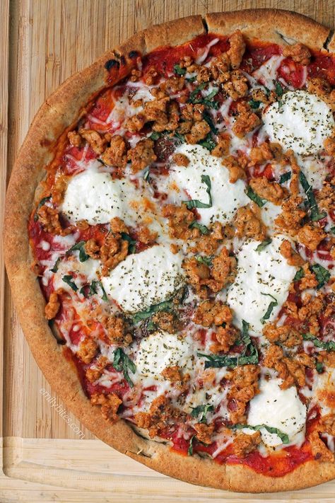 There’s no need to order in or go out for pizza when you can make this delicious lightened up Sausage and Ricotta Pizza at home in about 20 minutes! Each slice is just 193 calories or 6 Weight Watchers SmartPoints. www.emilybites.com Pizza Sausage, Emily Bites, Ricotta Pizza, Cook Dog Food, Creative Pizza, Pizza At Home, Artisan Pizza, Quick Dinners, Pizza Pie