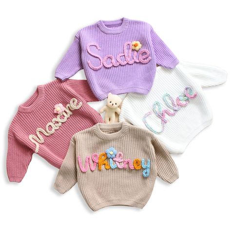 PRICES MAY VARY. 💝 CUSTOMIZE: You can custom name on a sweater. Click the "Customize Now" button to design your own shirt and create the best personalized gift for a loved one. 💝 HIGH-QUALITY MATERIAL: These knit sweaters with name are made with a distinctive soft and comfortable cotton blend it will make you feel soft and comfortable all day, cozy and breathable 🎁OCCASIONS: This embroidered knit sweater is the perfect gift for a mom-to-be or baby shower! Suitable for birthday, Christmas, Win Baby Name Sweater, Newborn Sweater, Hand Embroidered Name, Name Sweater, Newborn Family Photos, Pull Rose, Pull Bebe, Pull Crochet, Personalized Newborn