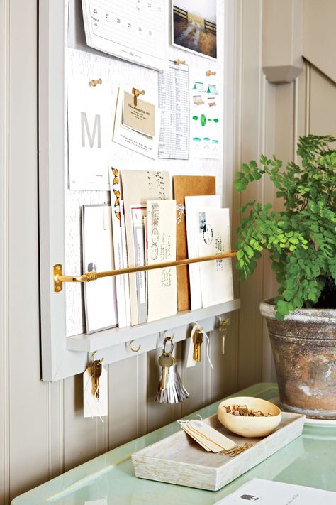 Entryway command center: Paint a corkboard to blend into the wall. Add a ledge and a curtain rod to display mail. Screw in cup hooks to hold keys. | marthastewart.com Martha Stewart Organizing, Command Center Kitchen, Home Command Center, Space Saving Bathroom, Family Command Center, Paper Clutter, Entryway Organization, Command Center, Home Organisation