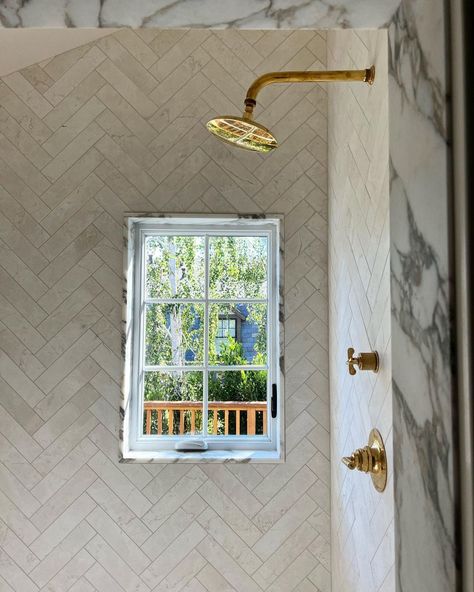 herringbone tile shower marble window trim Marble Herringbone Bathroom, Tile Around Window, Herringbone Shower Tile, Herringbone Shower, Spa Vibes, Marble Shower Tile, Marble Herringbone, Window In Shower, Modern Colonial