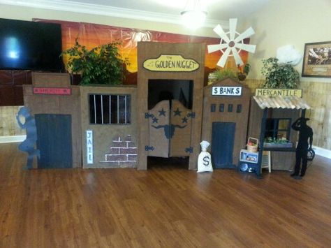 Wild West VBS ... Western town ... kid friendly access for dressup and playtime...made from appliance boxes Diy Cardboard Western Town, Cowboy Town Wild West, Wild West Dramatic Play, Wild West Parade Float Ideas, Wild West Trunk Or Treat, Cowboy Trunk Or Treat, Wild West Vbs, Wild West Classroom, Wild West Party Theme