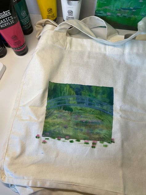 Tote bag painting inspired by Monet, nature painting, aesthetic art, aesthetic vibes, clothing decor, clothing painting Monet Tote Bag, Painting Totes Ideas, Painting A Tote Bag, Tote Bag Painting Aesthetic, Bag Painting Ideas Diy, Tote Bag Design Paint, Tote Bag Diy Paint, Painted Tote Bag Aesthetic, Tote Bag Ideas Paint