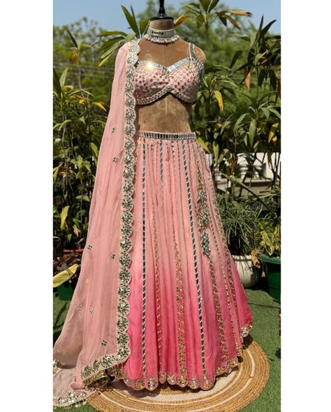 Shiny mirrors are hand crafted in a linear pattern on this blossom pink ombré lehenga, a statement embroidered blouse is a sure head turner. Paired with a beautiful scalloped organza dupatta. It’s a perfect glamorous outfit for the up coming wedding season. It can be customised in any color of your choice. To place your order DM or WhatsApp us at +91 9971767771. Shop Now- [ Indian wedding lehenga, destination wedding outfits, ombré lengha, bride to be, mehendi/ Sangeeta lehenga choli, o... Destination Wedding Outfits, Shaded Lehenga, Ombre Dupatta, Indian Wedding Lehenga, Organza Lehenga, Glamorous Outfits, Pink Lehenga, Linear Pattern, Wedding Lehenga