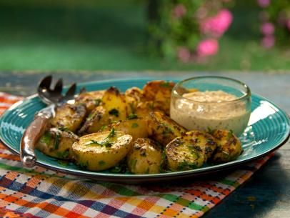 Mustard Aioli Grilled Potatoes with Fine Herbs  Read more at: http://www.foodnetwork.com/recipes/bobby-flay/mustard-aioli-grilled-potatoes-with-fine-herbs-recipe.html?oc=linkback Mustard Aioli, Bobby Flay Recipes, Grilled Potatoes, Food Network Canada, Herb Recipes, Bobby Flay, Sliced Potatoes, Barbecue Recipes, Potato Dishes