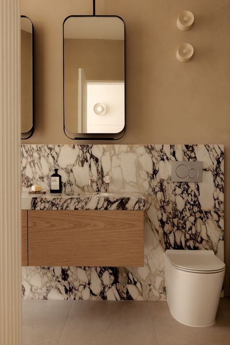 Marble ensuite vanity. Bathroom With Mirror Wall, Transitional Primary Bathroom Design, Contemporary Classic Bathroom, Quiet Luxury Bathroom, Vanity Next To Toilet, Powder Room Makeover Inspiration, Bold Powder Room Ideas, Small Marble Bathroom, Classic Bathroom Ideas