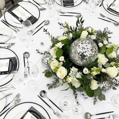 CANDY WEDDING STUDIOS. Design. Print. Hire | Not sure if you’ve noticed but disco balls are in 😂 🪩💃 Fresh florals, disco balls, our black rim chargers, cutlery, black napkins… | Instagram Disco Ball Table Centrepiece, Disco Ball Wedding Centerpiece, Disco Ball Table Centerpiece, Disco Ball Centerpiece Ideas, Wolf Christmas, Candy Wedding, Black Napkins, Wonderland Christmas, Ball Wedding