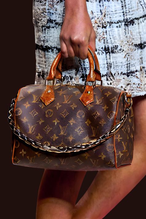 Louis Vuitton's Spring-Summer 2025 handbag collection, revealed at Paris Fashion Week, is a masterclass in the brand's ongoing transformation. Set within the grandeur of the Louvre’s Cour Carrée, the show’s distinctive "trunkway" runway, crafted from over 1,000 of the brand's signature trunks, instantly signaled a bold and innovative spirit. Nicolas Ghesquière, artistic director for womenswear, showcased handbags that honor Louis Vuitton's legacy while introducing his unique, modern flair. Speedy Bag, Summer 2025, Handbag Collection, The Louvre, Monogram Canvas, Paris Fashion, Paris Fashion Week, Louvre, Fashion Week