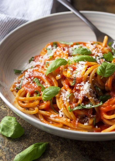 For an authentic Italian dinner, try my pasta al pomodoro! Spaghetti is tossed with a simple and delicious San Marzano tomato sauce and topped with basil and Parmesan in this easy recipe. | justalittlebitofbacon.com #italianrecipes #pastarecipes #easydinner #italian #spaghetti #pasta #tomatosauce Italian Sausage Pasta Bake, Italian Pasta Recipes Authentic, Authentic Italian Pasta, Italian Pasta Recipe, Chipotle Pasta, Tomato Sauces, Pomodoro Sauce, Pasta Al Pomodoro, Ambrosia Recipe