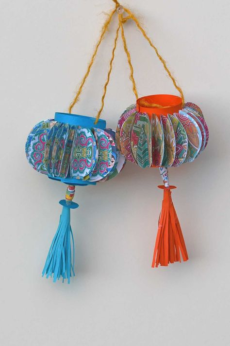 Add a splash of color to your home with these homemade paper lanterns. Our DIY guide makes it fun and easy to create stunning, colorful lanterns that can brighten any room or occasion. Chinese Lantern Craft, Chinese Lanterns Diy, Obon Festival, Chinese Decorations, Diy Paper Lanterns, Chinese New Year Lantern, Colorful Lanterns, Lantern Crafts, Lanterns Diy