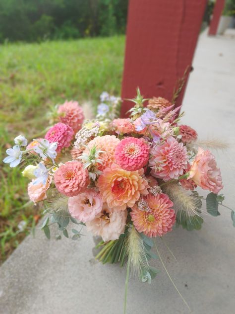 Apricot and Salmon mid Summer Bridal Bouquet of Dahlia, lisianthus, Delphinium, zinnia, and grasses Coral Dahlia Bouquet, Dahlias Bridal Bouquet, Garden Wedding Bridal Bouquet, Dahlia And Zinnia Wedding Bouquet, Dahlia Zinnia Bouquet, Dahlia Market Bouquet, Zinnia Flower Bouquet, Zinnia Bouquet Ideas, Dahlia And Peony Bouquet