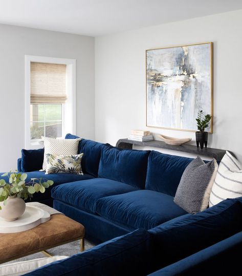 Created by @ashamaiadesign and captured by @jennverrierphoto, this luscious blue lounge feels like the perfect place to jumpstart the year. A sapphire blue velvet Sylvie Sectional Sofa adds verve to this space. 💙 Blue Velvet Sofa With Chaise, Navy Blue Leather Sectional Sofa, Navy Blue L Shape Sofa Living Room, Navy Beige Living Room Decor, Dark Blue Velvet Sofa Living Rooms, Navy L Shaped Sofa, Cushions For Navy Sofa, Blue Sofa Lounge Ideas, Rooms With Navy Sofas