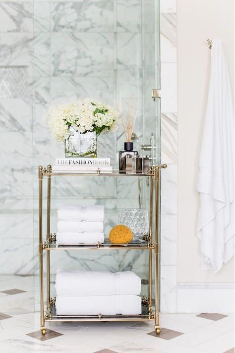 A refined gold and glass rolling cart is a gorgeous option for a sophisticated and chic bathroom Chic Bathroom, Smart Bathroom, Rolling Cart, Chic Bathrooms, Stylish Bathroom, Bathroom Shelves, Towel Rack, Wardrobe Rack, Ladder Decor