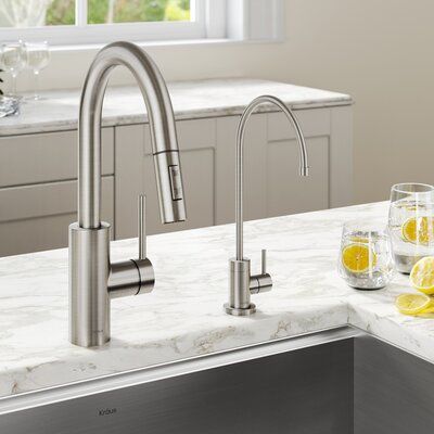 Kraus Create clean contemporary style and redefine the functionality of your kitchen with the Oletto™ Pull-Down Faucet and Purita™ Drinking Water Dispenser Combo. Designed with QuickDock technology for easy installation, the pull-down faucet pairs with a filter faucet that connects to a range of under-counter purification systems and saves money by eliminating the need for bottled water – a package that adds value to any home! Finish: Spot Free Stainless Steel Kohler Kitchen Faucet, Water Filter Faucet, Kitchen Rehab, Modern Kitchen Faucet, Filtered Water Faucet, Faucet Kitchen, Brass Kitchen Faucet, Faucet Design, Single Handle Kitchen Faucet