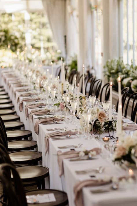 Small floral arrangements line banquet table covered with white tablecloth and fabric pink napkins White Tablecloth Tablescape, White Tablecloth Beige Napkins Wedding, Pink Table Linens Wedding, Wedding Rectangular Table Decorations, Taupe Tablecloth Wedding, Wedding Table Decor Rectangle Tables, Cream Table Cloth Wedding, Round Table Runner Wedding, Champagne Tablecloth Wedding