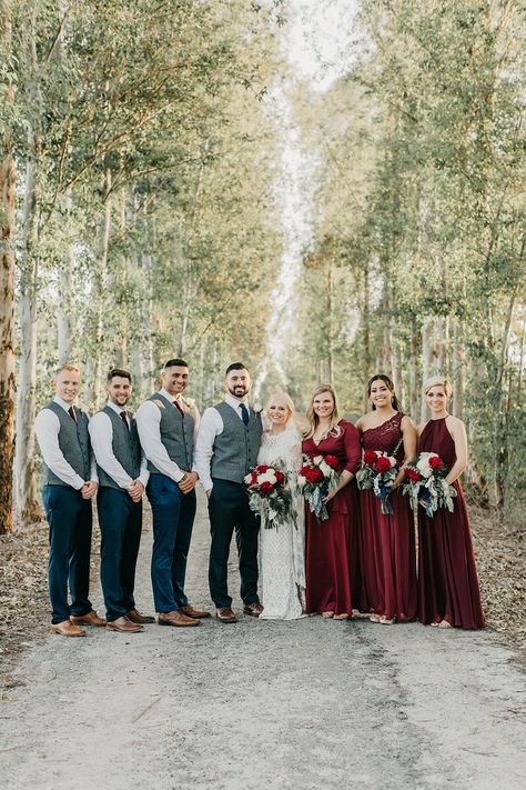 Chic Winter Wedding with a Tree Farm Ceremony Backdrop #winterweddingcolors #rusticceremonybackdrop #treefarmweddingvenue Burgundy And Jeans Wedding, Groomsmen Attire For Winter Wedding, Winter Groomsmen Attire Burgundy, Groomsman Attire Winter Wedding, December Wedding Bridal Party, Winter Wedding Bridal Party Attire, December Wedding Groomsmen, Groomsmen Winter Wedding, Winter Wedding Groomsmen Attire