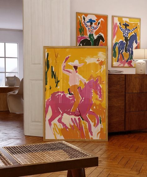 Add a touch of Southwestern flair to your home with this set of 3 vibrant cowboy prints. Each print features a dynamic cowboy scene, rendered in bold, eye-catching colors that capture the spirit of the rodeo. Perfect for adding a pop of color to your living room, office, or bedroom, these prints make a great gift for lovers of Western art and culture. High-resolution digital download Printable in multiple sizes to fit your space Instant download, no physical product will be shipped Unique and co Unique Painting Styles, Artful Eclectic Living Room, Interior Design Paintings Wall Art, Modern Western Wall Art, Funky Colorful Art, Colorful Game Room, Abstract Western Art, Paints For Bedroom Walls, Eclectic Western