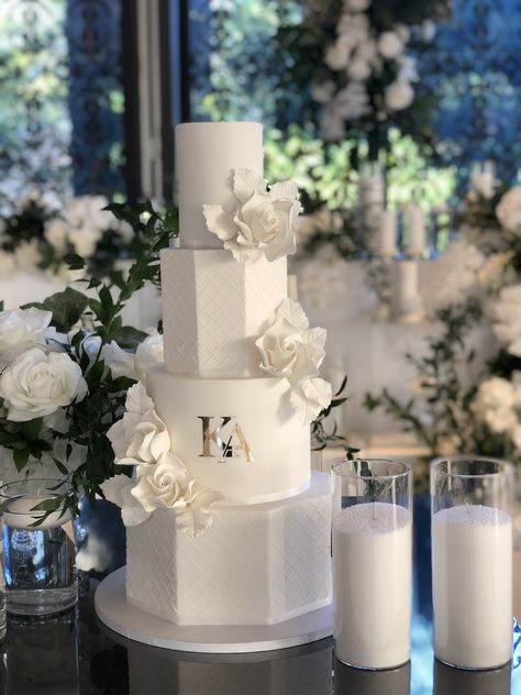 A beautiful mixture of round and hexagon tiers for this four teir modern wedding cake, featuring lattice stenciling, white sugar flowers and gold monogram. Wedding Cakes Stencil, Octagon Wedding Cake, Hexagon Wedding Cakes, 4tier Wedding Cake, Traditional White Wedding Cake, Hexagon Cake Design, Big Wedding Cakes Elegant, Four Tier Wedding Cakes, 4 Tier Wedding Cake Elegant