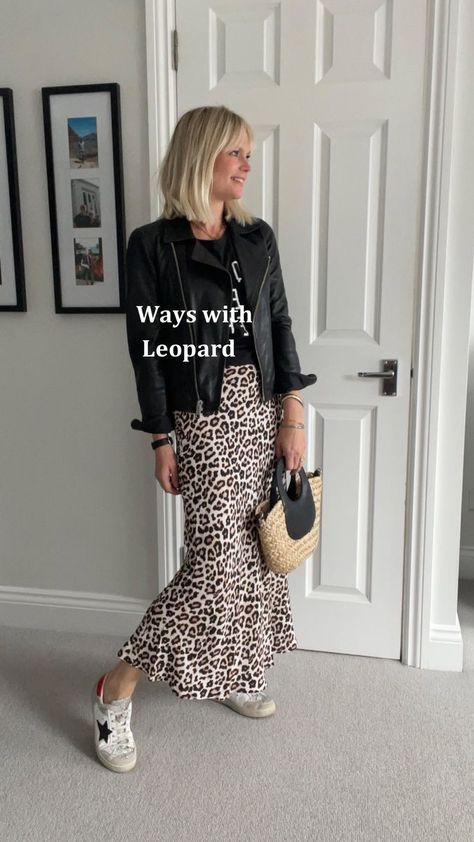 Wearing leopard print 🐆 🐆🐆 I have lost count of the number of outfits here but there are sooooo many different ways (and I could have carried on) to wear a leopard print skirt… 🐆 With plain and slogan tees 🐆 Add denim/leather jackets 🐆 Trainers/sandals/boots/heels of various styles depending on the look you want to create. 🐆 A shirt is also lovely. 🐆 And sweatshirts/ fine or chunky knits. 🐆 Plus dress it up for the evening with a cami and blazer. I definitely think this surpasses my Rul How To Wear A Black Skirt, Leopard Print Skirt Outfit Autumn, Leopard Silk Skirt Outfit, Leopard Satin Skirt Outfit, Leopard Skirt Outfit 2024, Midi Skirt Outfit Work, Printed Midi Skirt Outfit, Skirt Outfits Dressy, Leopard Midi Skirt Outfit