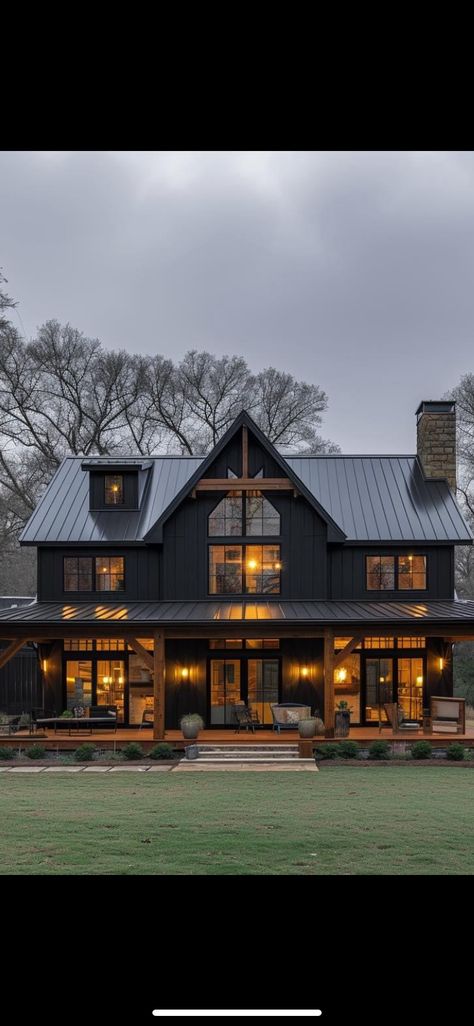 Black Barnhouse Homes, Black And Dark Wood House Exterior, Dark Metal House, Modern Rustic Home Design Exterior, Black Tin House Exterior, Dark Farmhouse Exterior Wrap Around Porch, Modern Black House Design, Barndominium Dark Exterior, Black House Wrap Around Porch