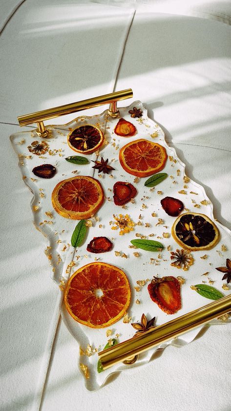 Natural dried fruits, spices and greens will create a wonderful mood for you. The tray is made of epoxy resin. Treat with care, if dirty, wipe with a damp cloth, then dry. Do not wash in the dishwasher. Do not scratch. Size: length 29cm, width 18cm, height 4cm Dried Fruit Resin, Resin Ideas To Sell, Epoxy Resin Tray, Epoxy Resin Projects, Epoxy Furniture, Resin Fruit, Resin Inspiration, Coaster Art, Resin Tray