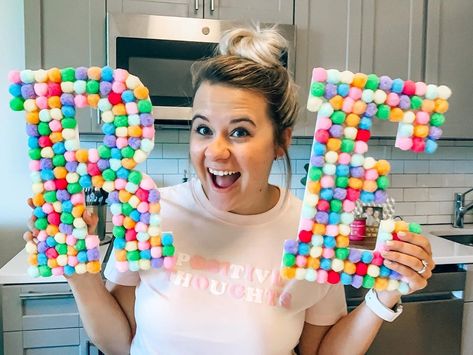 Montana Riley on Instagram: “Covering these wooden letters in pom poms was such a fun little project I did this summer! 🤍🌈 I got the wooden letters from…” Diy Trolls Birthday Party, Botanical Party, Pom Pom Letters, Pom Wreath, Plastic Lace, Diy Pom Poms, Read Sign, Trolls Birthday Party, Pom Pom Wreath