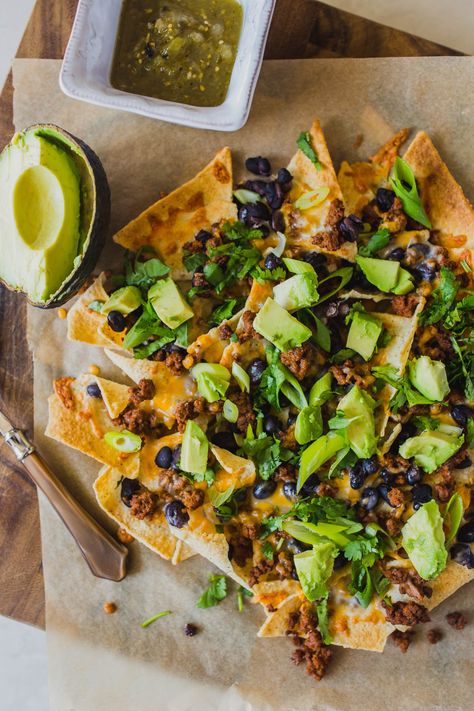 Looking for easy grain free dinners? These sheet pan beef nachos are so simple and so delicious! You only need a few ingredients like grassfed ground beef, black beans, Siete tortilla chips, avocado, cilantro and grated cheese for this easy grain free dinner. Click through for how to make these clean eating healthy nachos. #healthynachos #cleaneating #grainfree #grassfedbeef Grain Free Dinners, Sheet Pan Beef, Grain Free Dinner, Healthy Nachos, Sheet Pan Nachos, Pan Nachos, Beef Nachos, Healthy Flour, Nachos Recipe Easy