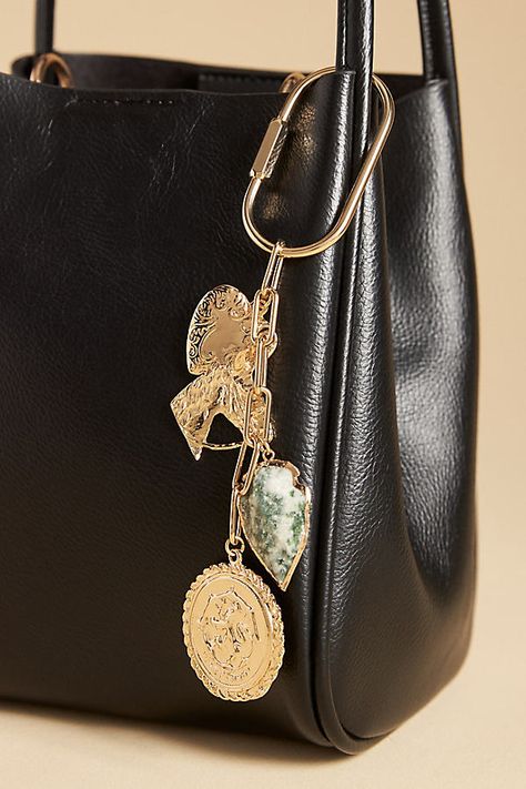 Charming new-trend alert: jewelry for your bag. | Brass & Stone Bag Charm by Anthropologie in Gold, Women's, Brass/Resin Purse Charms Aesthetic, Purse Trinkets, Diy Purse Charms, Bag Charms Aesthetic, Bag Charms Diy, Elegant Keychain, Diy Bag Charm, Purse Charms Diy, Luxury Keychain