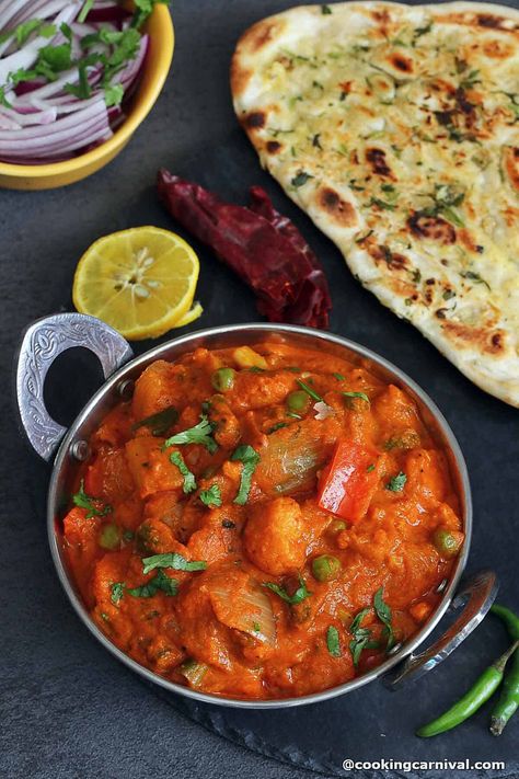 Spicy Mix vegetable curry that is made to mimic the flavors from Kolhapur, this Veg Kolhapuri sabji is the best, most flavorful, and restaurant-style recipe! Mixed vegetables are cooked and then simmered in spicy, onion-tomato-garlicky gravy and served with Tandoori roti or garlic Naan! Make this for any party or gathering; your guests will have a hard time believing this wasn’t ordered from a restaurant! #curry #indian #mexveg #vegkolhapuri #punjabi #naan #roti #paratha Veg Kolhapuri, Naan Roti, Mix Vegetable, Curry Indian, Ginger Green Beans, Tandoori Roti, Restaurant Style Recipes, Veg Curry, Garlic Naan