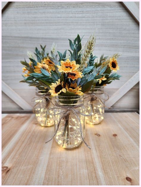 [Promotion] 'Fall Is In The Air! Choose Lighted Or Unlighted. These Beautiful Pint Sized Mason Jar Centerpieces Are Perfect For Your Next Event. They Are Very Popular For Weddings, Baby Showers, Parties, Corporate Events, Holiday Events, And Any Other Event That Requires Table Centerpieces. They Also Look Great In Any Room Of Your House Or Office. To See Other Lighted Jar Options And All Of My Other Listings, Please View My Shop: #masonjarfallcenterpiecesparty Sunflower Wedding Centerpieces, Fall Mason Jar Centerpieces, Jar Centerpiece Wedding, Fall Mason Jars, Sunflower Themed Wedding, Jar Centerpieces, Country Theme Wedding, Centerpiece Table, Fall Wedding Centerpieces