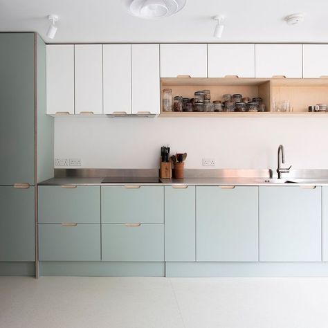 The cool palette of white and light sage fronts with a stainless steel worktop is countered with the warmer tones and texture of open birch… | Instagram Steel Worktop Kitchen, Stainless Steel Worktop, Sage And White Kitchen, Wood Bench Seating, Seafoam Kitchen, Pistachio Kitchen, Scandi Kitchen Ideas, Light Kitchen Colors, Light Gray Kitchen