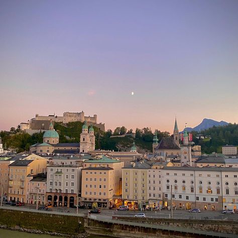 a view of Salzburg from a restaurant rooftop Salzburg Austria Aesthetic Winter, Austria Travel Aesthetic, Salzburg Austria Aesthetic, Vienna Austria Aesthetic, Austria Aesthetic, Moon Scenery, Rapunzel Movie, Germany Aesthetic, Scenery Aesthetic