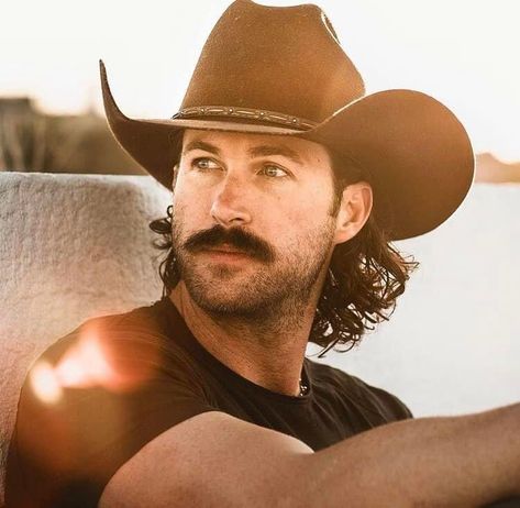 Cowboys With Long Hair, Cowboy With Mustache, Riley Green Hair, Cash Jessica Peterson, Rugged Cowboy Men, Cowboys With Mullets, Riley Green Wallpaper, Long Hair Cowboy, Cowboy Mullet